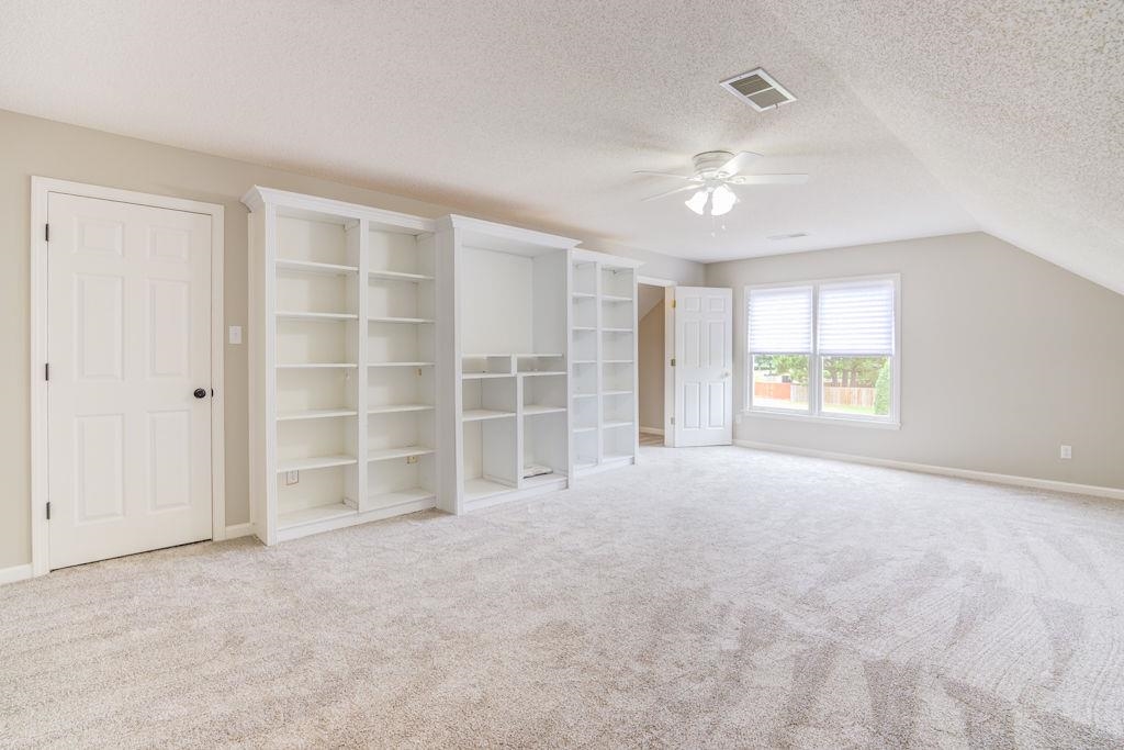 1633 Beckenhall Street Collierville, TN 38017 - Photo 27 of 35 wooden floor in an empty room with a window