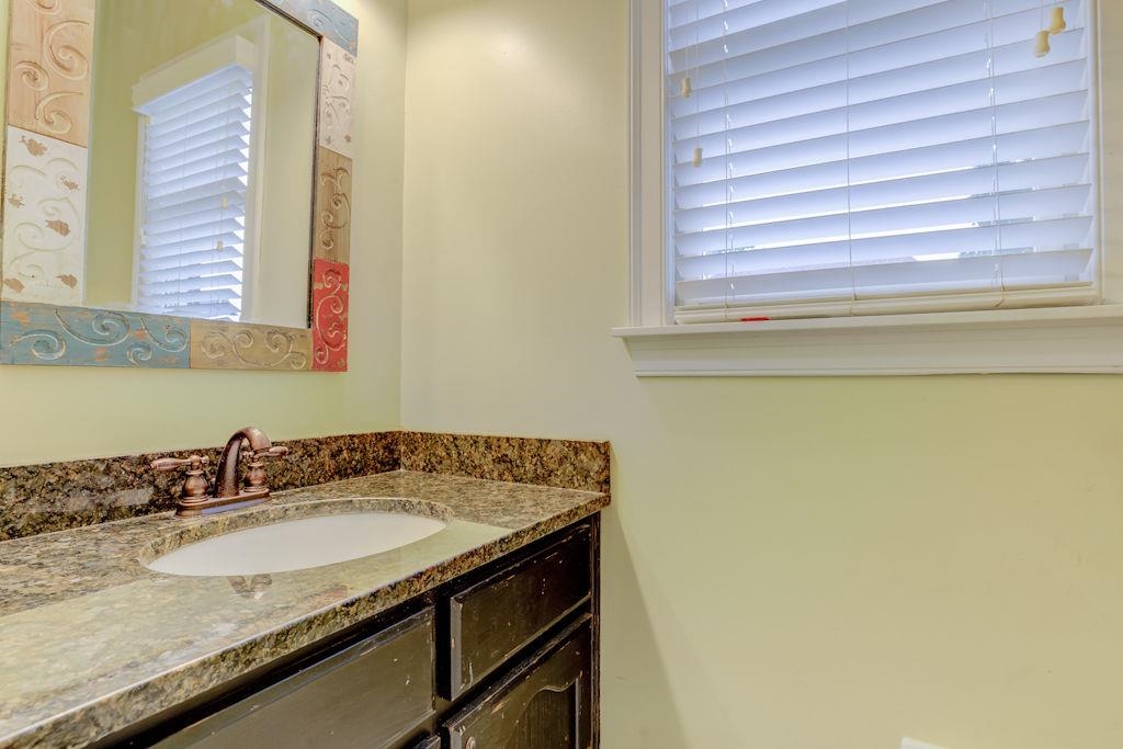 1633 Beckenhall Street Collierville, TN 38017 - Photo 29 of 35 a bathroom with a granite countertop sink and a mirror