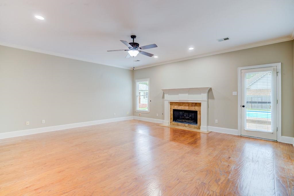 1633 Beckenhall Street Collierville, TN 38017 - Photo 7 of 35 a view of an empty room with a fireplace and a window