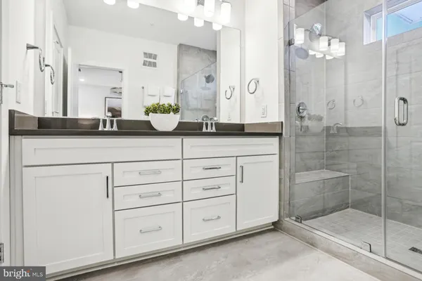 a view of a balcony with chair and wooden floor
