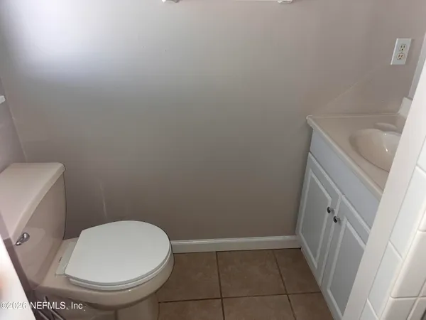 a bathroom with a sink and toilet