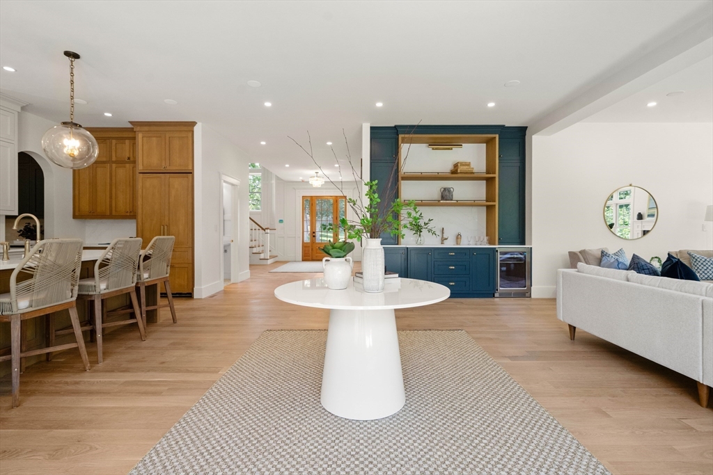 16 Foley Beach Road Hingham, MA 02043 - Photo 13 of 34 a living room with furniture a table and kitchen view