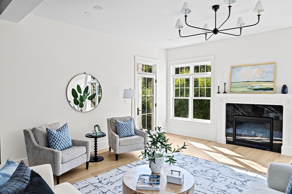 16 Foley Beach Road Hingham, MA 02043 - Photo 18 of 34 a living room with furniture a window and a fireplace