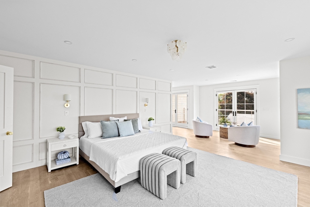 16 Foley Beach Road Hingham, MA 02043 - Photo 25 of 34 a bedroom with a bed and wooden floor