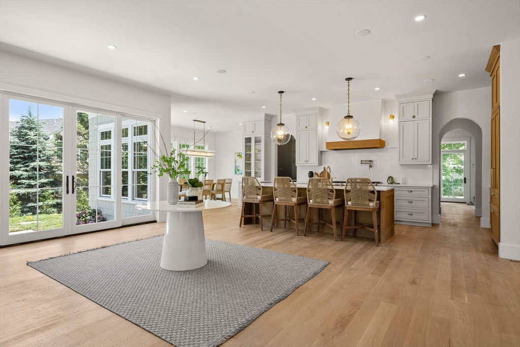 16 Foley Beach Road Hingham, MA 02043 - Photo 6 of 34 a view of a kitchen with dining table and chairs