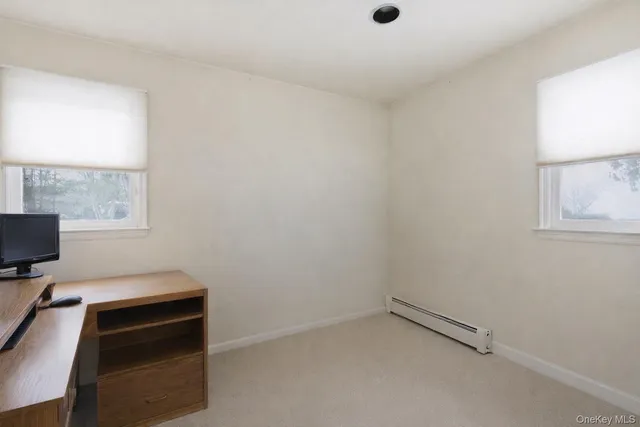 a room with a bed and a window