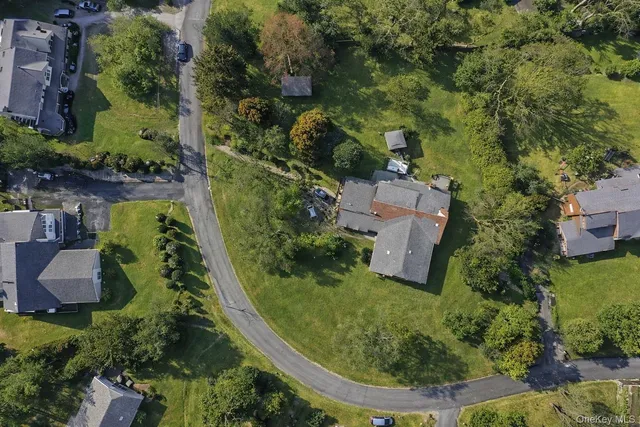 an aerial view of a house with outdoor space
