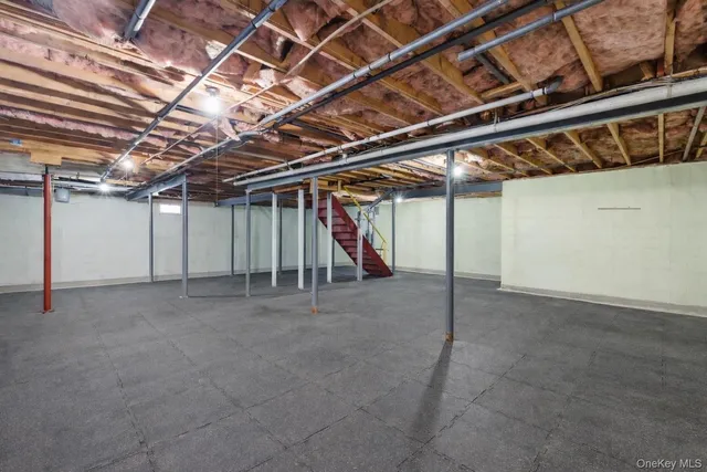 a view of a deck with wooden floor and fence next to a yard