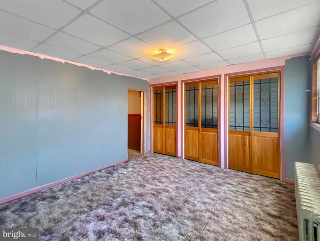 an empty room with fan