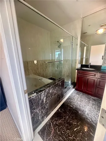 a bathroom with a mirror and a shower