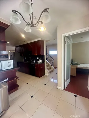 a view of a living room and kitchen