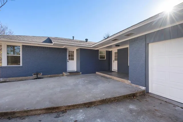 a view of an empty room with a garage