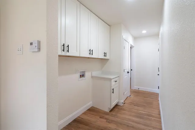 a view of cabinets and wooden floor