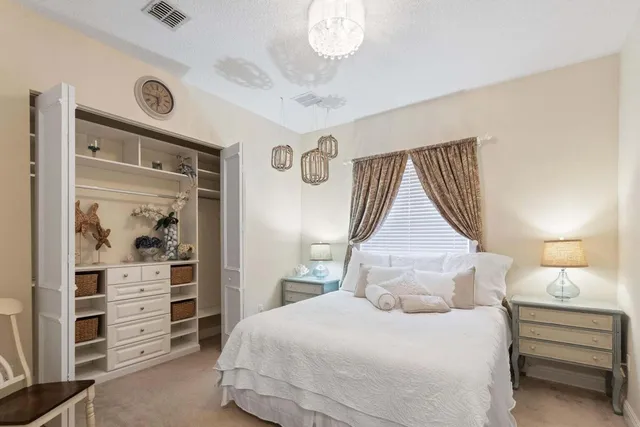 a bedroom with a bed and a cabinets