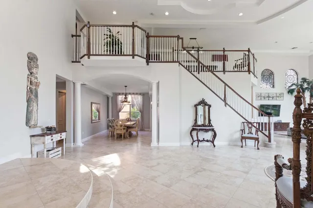 a view of a livingroom with furniture and a gym equipment