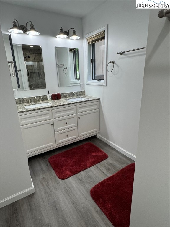 175 Ridgeview Road, Unit 2 Sugar Mountain, NC 28604 - Photo 16 of 20 a spacious bathroom with a granite countertop sink and a mirror
