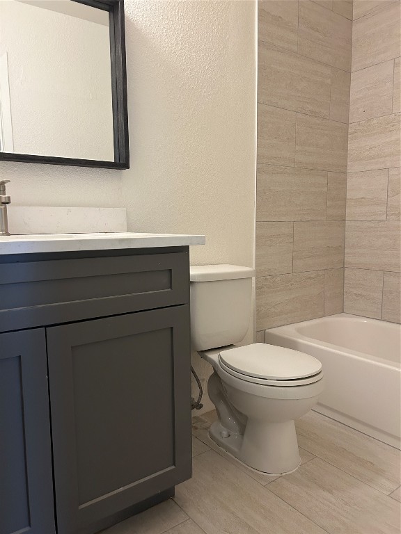 5903 Cougar Drive, Unit B Austin, TX 78745 - Photo 11 of 16 a bathroom with a sink a toilet and mirror
