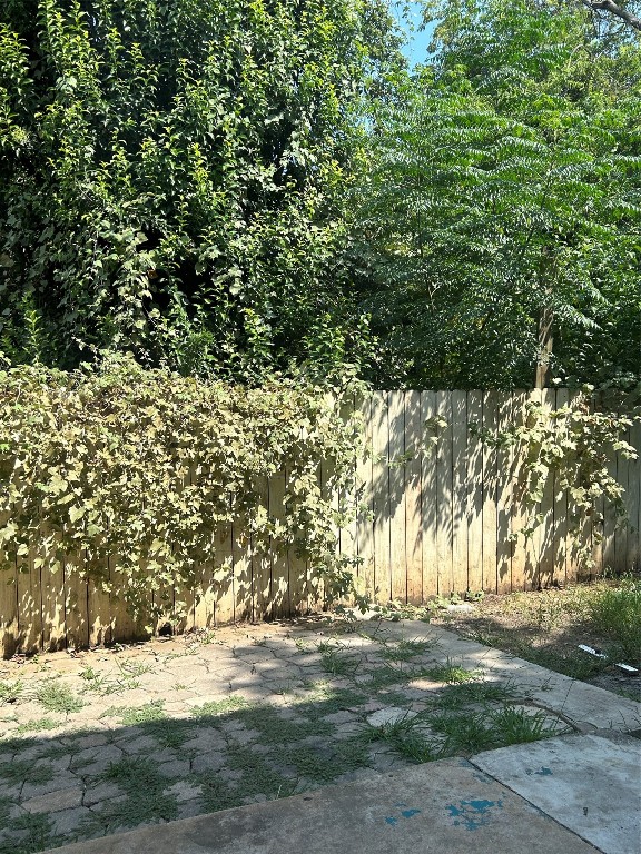 5903 Cougar Drive, Unit B Austin, TX 78745 - Photo 16 of 16 a view of a yard with a tree