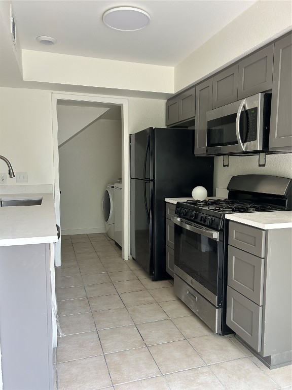 5903 Cougar Drive, Unit B Austin, TX 78745 - Photo 2 of 16 a kitchen with a refrigerator stove and microwave