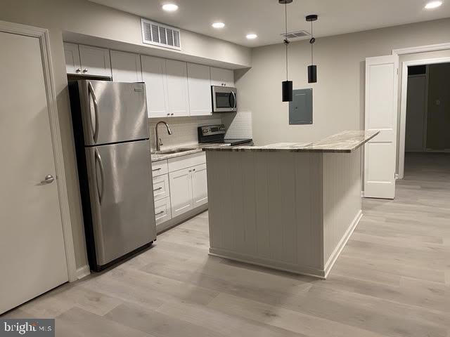 16 B Runnemede Road New Hope, PA 18938 - Photo 3 of 30 a kitchen with stainless steel appliances granite countertop a refrigerator a sink and a stove
