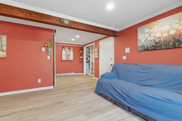 a living room with furniture and window