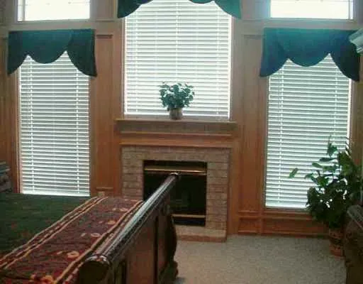 a view of a house with a balcony and a fireplace