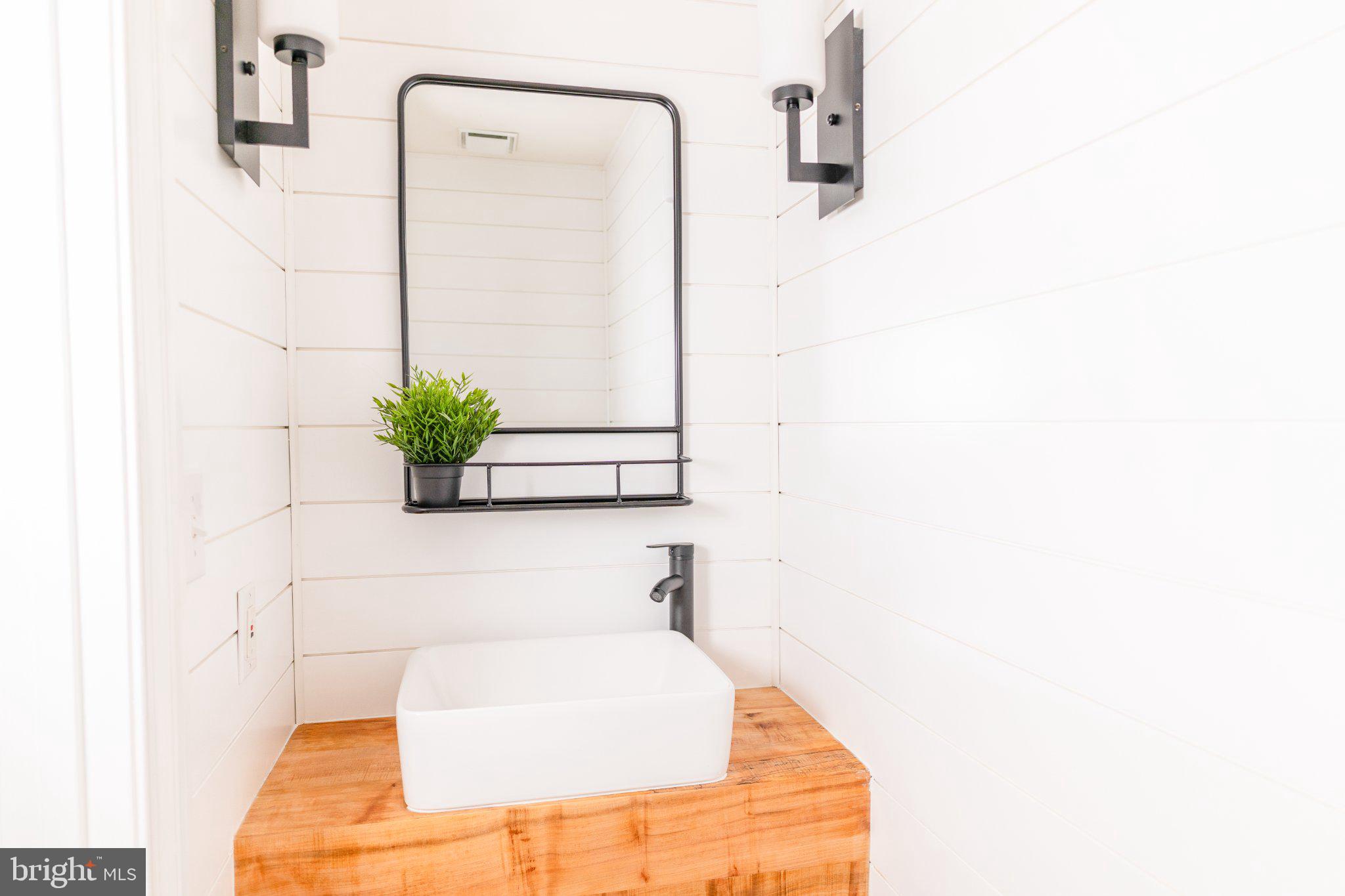 73 Village Grove Road Fredericksburg, VA 22406 - Photo 16 of 34 Sleek modern bathroom with natural charm.