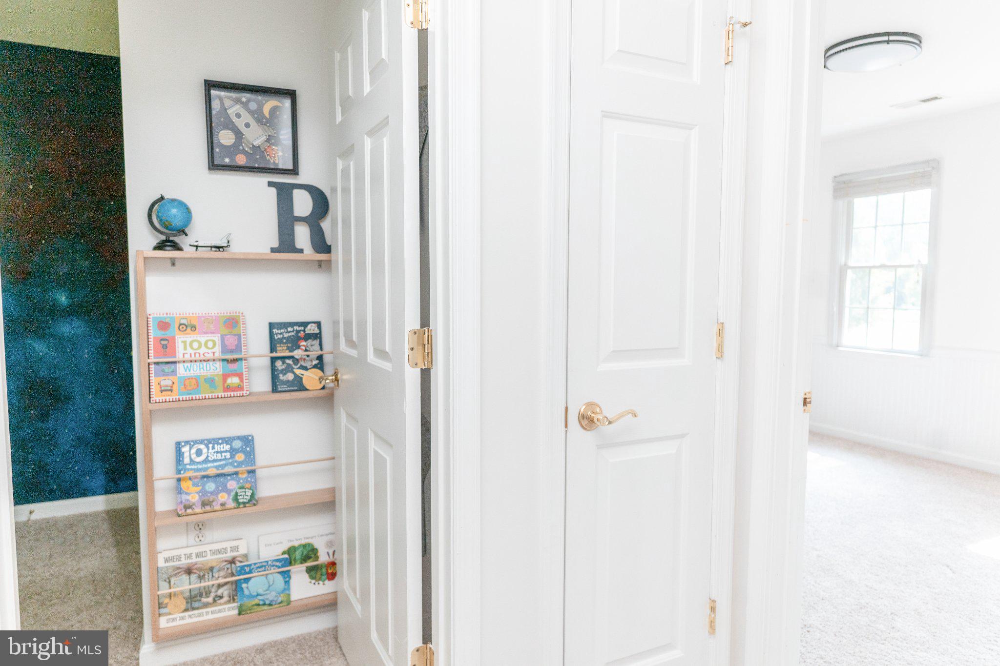 73 Village Grove Road Fredericksburg, VA 22406 - Photo 25 of 34 Bright hallway with playful decor.