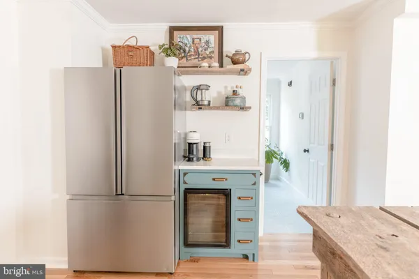 a kitchen with stainless steel appliances a refrigerator and a stove