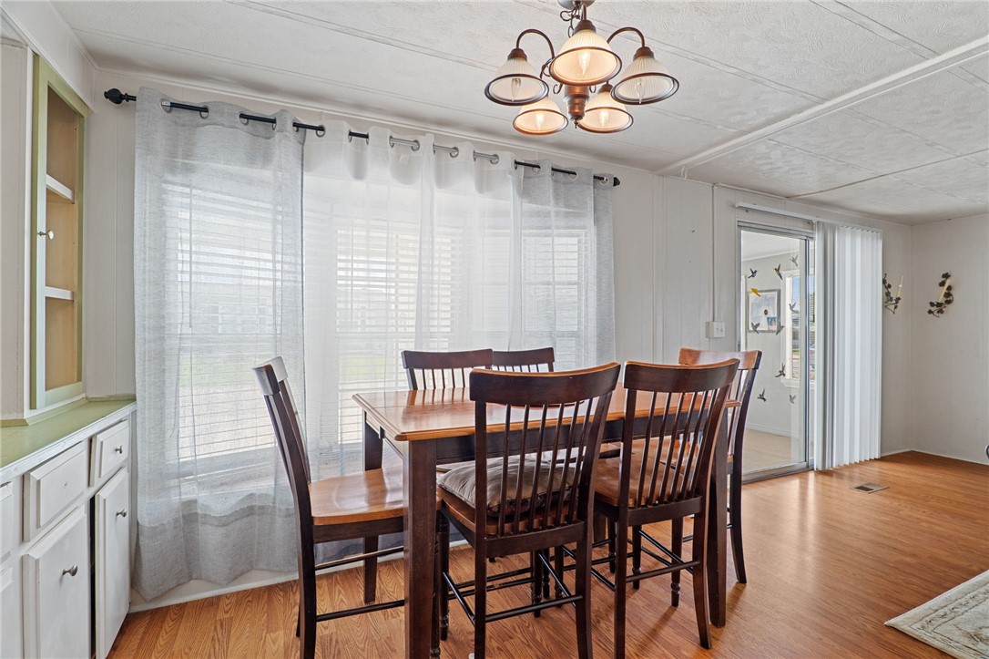 918 Cashew Circle Sebastian, FL 32976 - Photo 7 of 22 a view of a dining room with furniture window and wooden floor