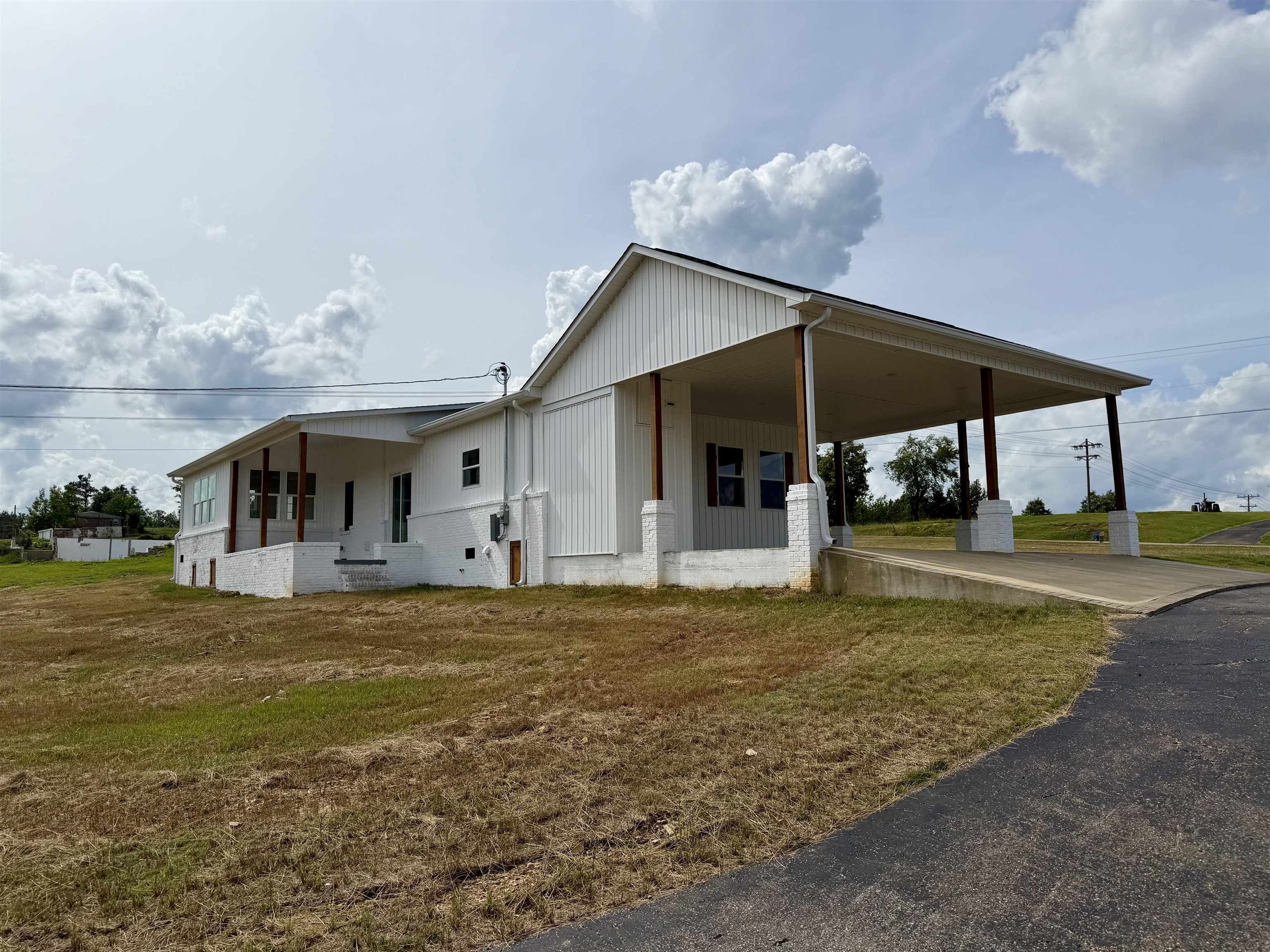 172 New Bethel Road Selmer, TN 38375 - Photo 28 of 30 a view of a house with backyard and sitting area