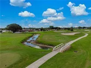 a view of a golf course with a lake