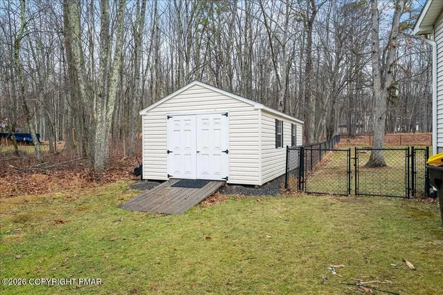 a view of a backyard with a small cabin
