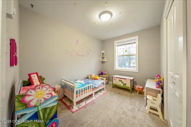 a room with toys and a book shelf