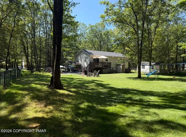 a view of a house with a big yard