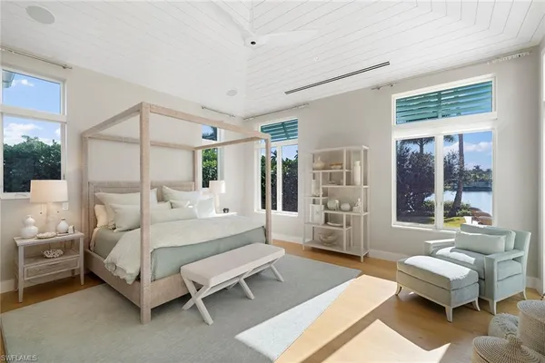 a bed room with a bed and a couch