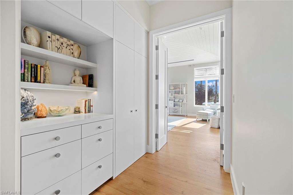 575 Palm Circle East Naples, FL 34102 - Photo 28 of 49 a view of an empty room with cabinet and mirror