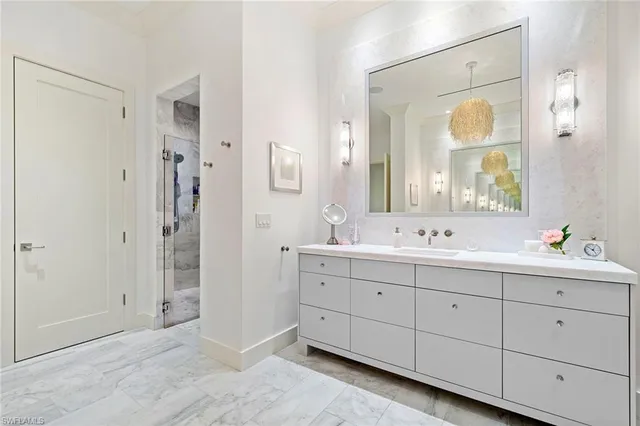 a bathroom with a double vanity sink and a mirror