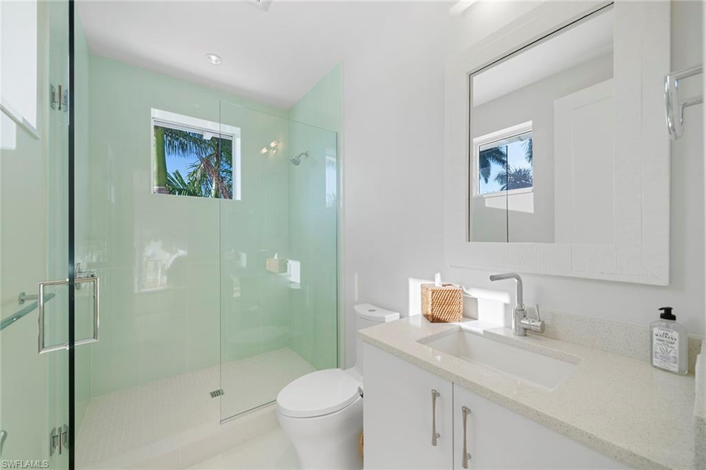 575 Palm Circle East Naples, FL 34102 - Photo 35 of 49 a bathroom with a sink toilet and shower