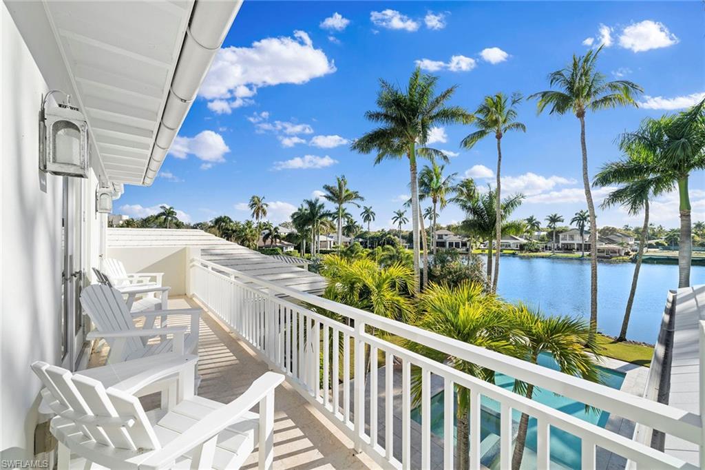 575 Palm Circle East Naples, FL 34102 - Photo 41 of 49 a view of a chairs and table in patio