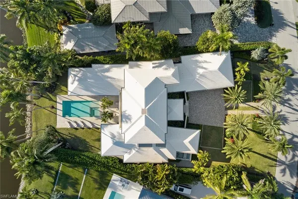 an aerial view of house with yard