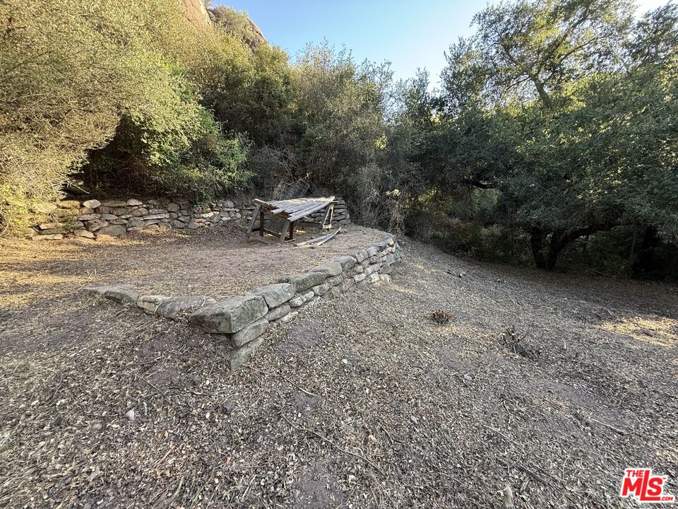 0 Red Rock Road Topanga, CA 90290 - Photo 9 of 53 a view of a backyard with a table and chair