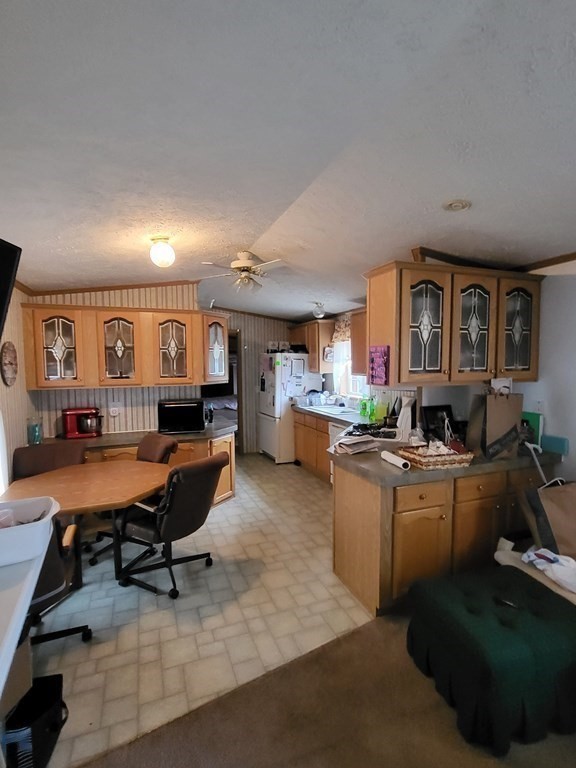 365 Main Street, Unit 2 Sturbridge, MA 01566 - Photo 15 of 24 a living room with furniture a piano and a dining table