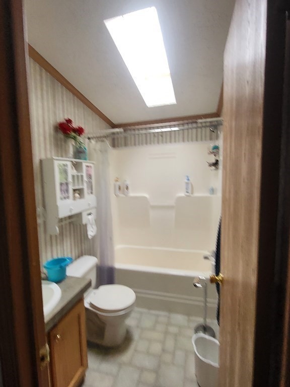 365 Main Street, Unit 2 Sturbridge, MA 01566 - Photo 21 of 24 a bathroom with a granite countertop bathtub shower sink vanity and toilet