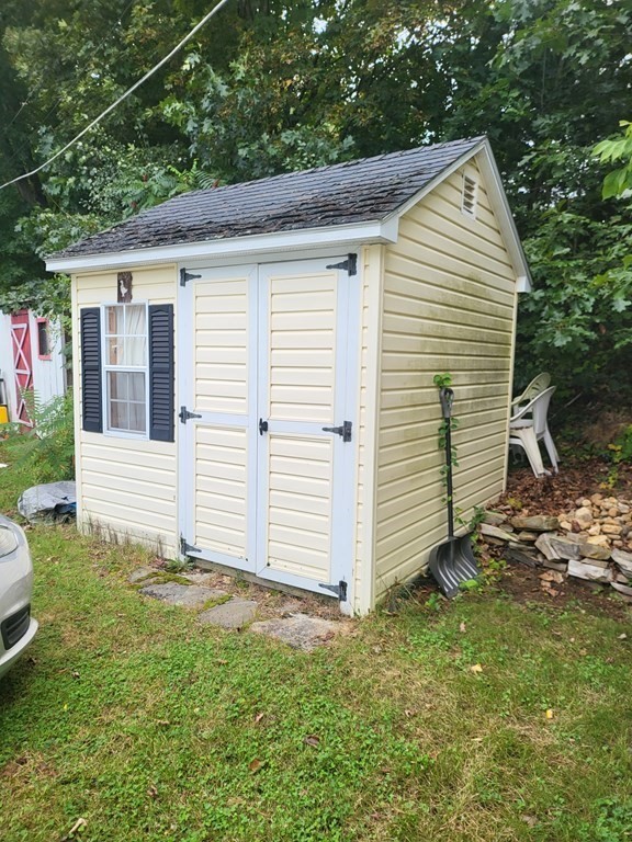 365 Main Street, Unit 2 Sturbridge, MA 01566 - Photo 6 of 24 a view of a house with a yard