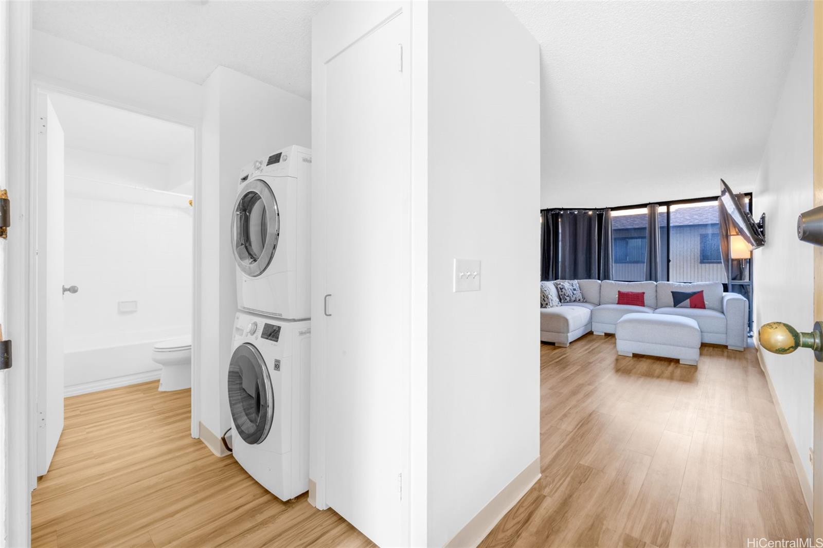 1820 Waiola Street Honolulu, HI 96826 - Photo 3 of 17 a living room with furniture and a wooden floor