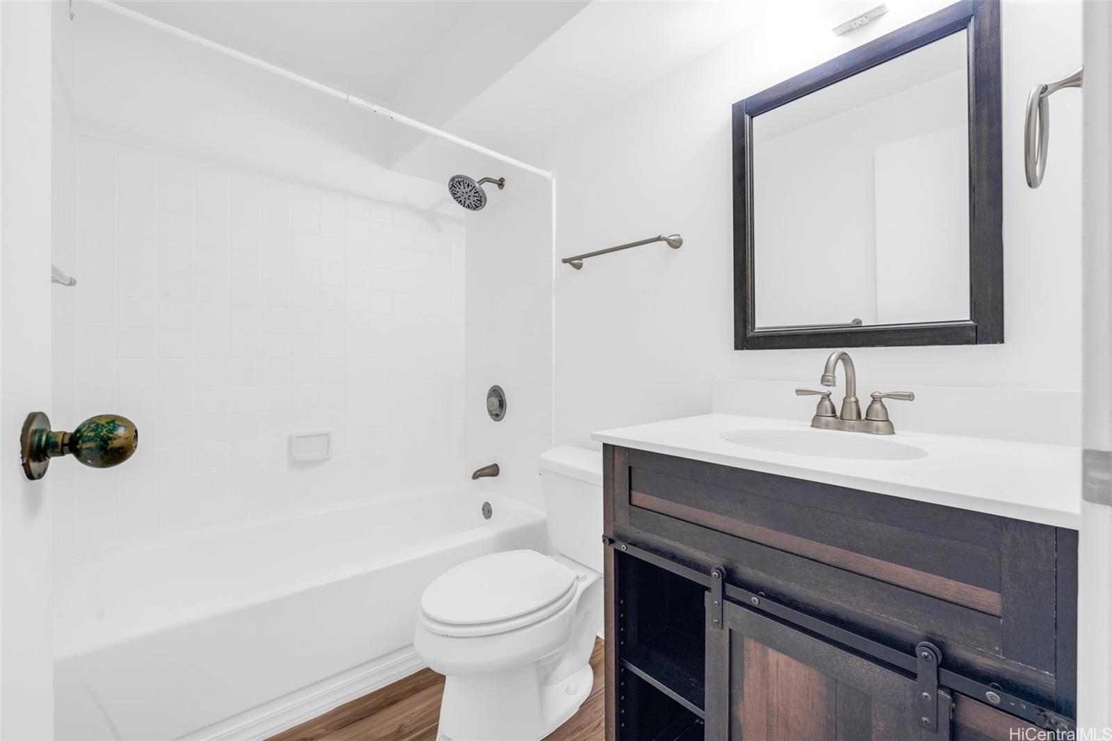 1820 Waiola Street Honolulu, HI 96826 - Photo 10 of 17 a bathroom with a sink a toilet and shower