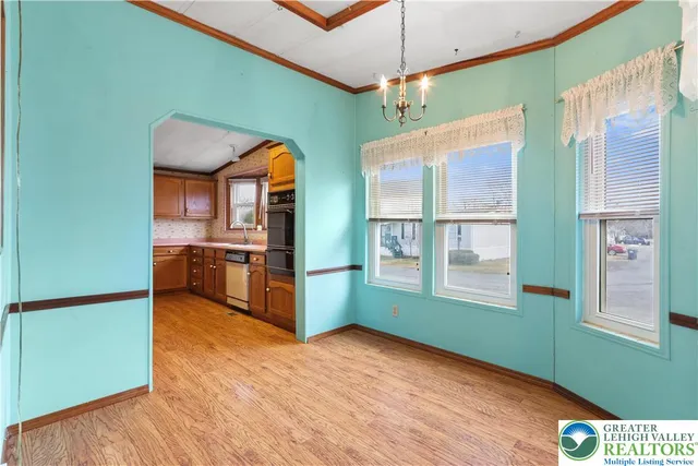 a spacious bathroom with a granite countertop sink and a large mirror