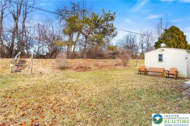 a view of yard covered with snow