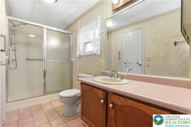 a view of a porch with wooden floor and fence